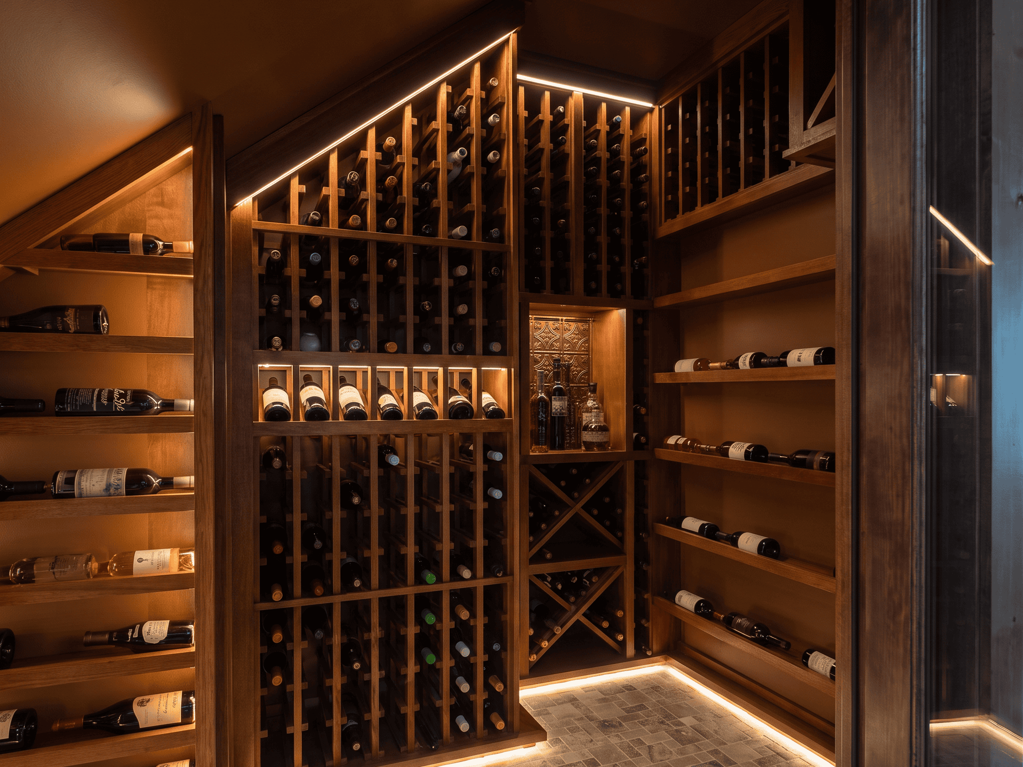 Elegant wine cellar with wooden racks filled with wine bottles and ambient lighting.